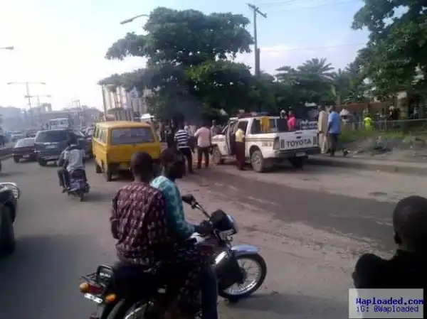 Photo: LASTMA officials escape unhurt from their vehicle after an arson attack by a danfo driver